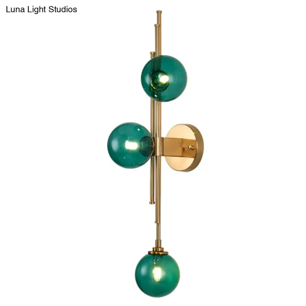 Mid century brass finish 3 light clear glass orb sconce living room