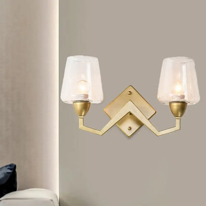 Mid-century brass wall lamp with truncated cone shade for bedroom