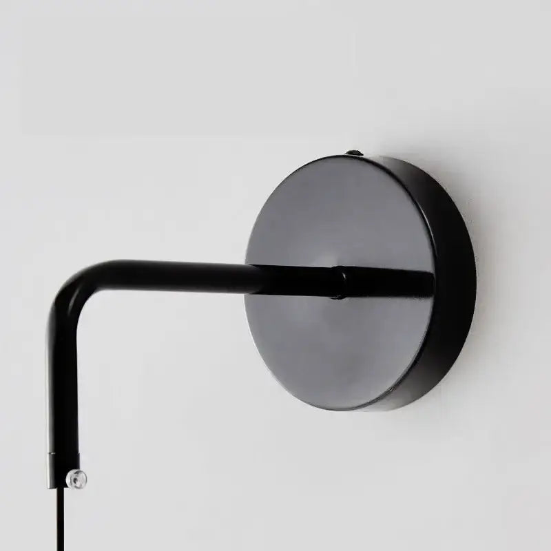 Minimalist black copper wall lamp bedroom sleek circular light