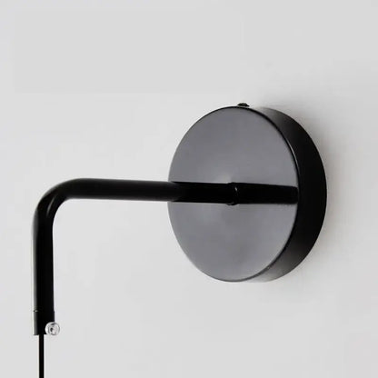 Minimalist black copper wall lamp bedroom sleek circular light