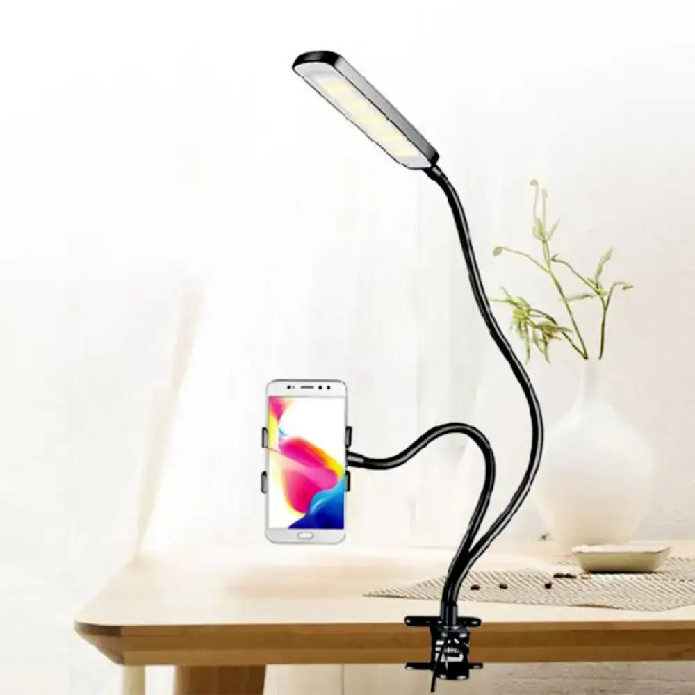 Minimalist black flexible arm desk lamp with phone holder bedroom