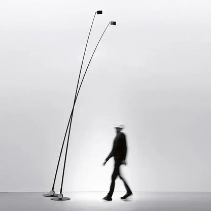 Minimalist black floor lamp with curved led arms for living room