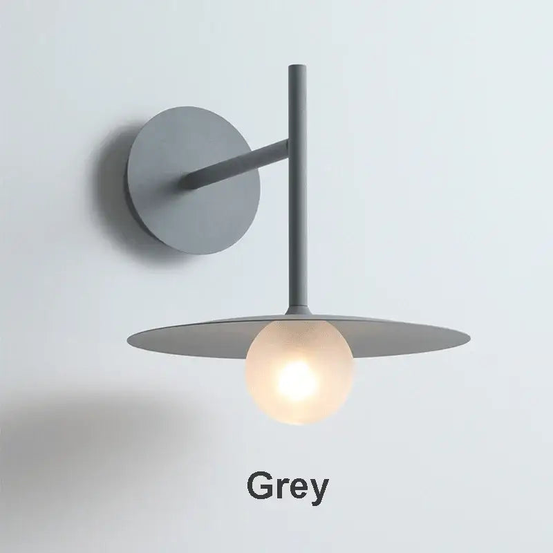 Minimalist black flying saucer wall lamp for bedroom decor