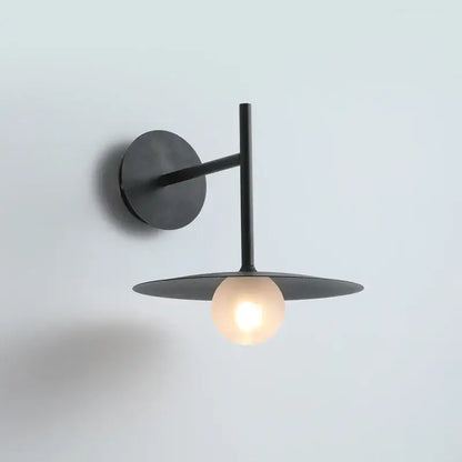 Minimalist black flying saucer wall lamp for bedroom decor