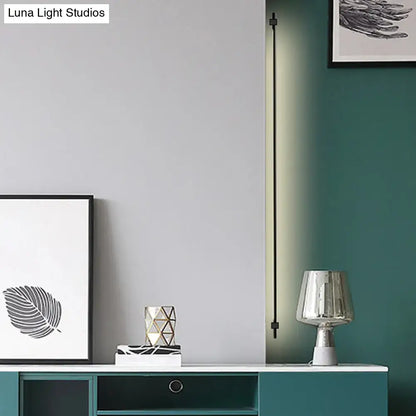 Minimalist black & gold feather wing wall lamp for living room