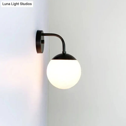 Minimalist black & gold wall light with milky glass ball for bedroom