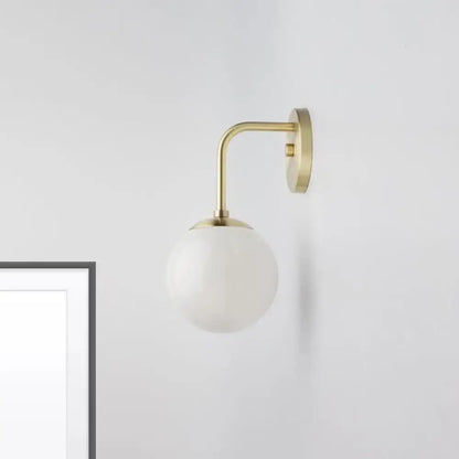 Minimalist black & gold wall light with milky glass ball for bedroom