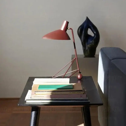 Minimalist black metal tripod desk lamp for bedroom or office