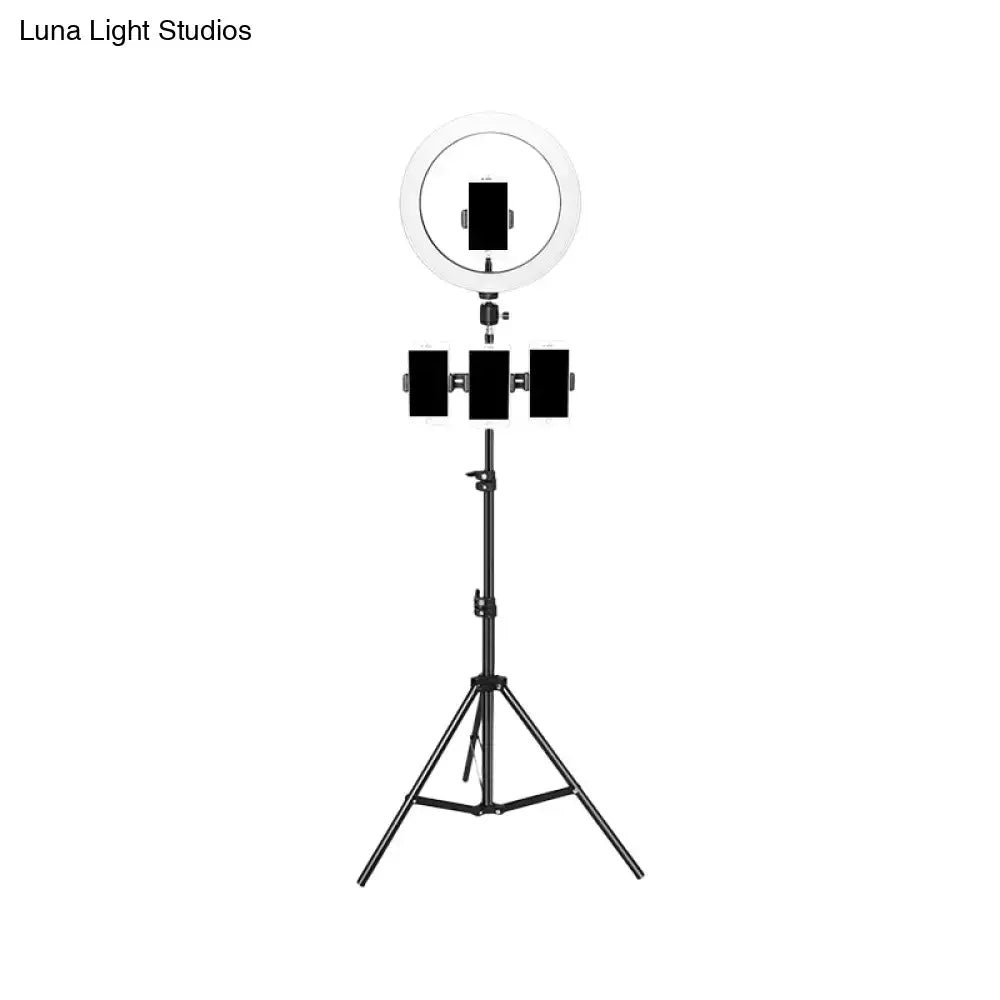 Minimalist black & white mobile phone holder with ring light bedroom