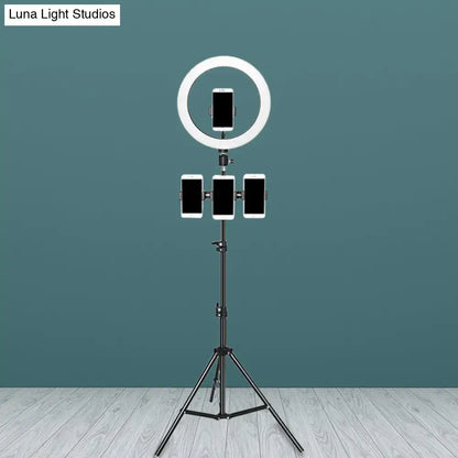 Minimalist black & white mobile phone holder with ring light bedroom