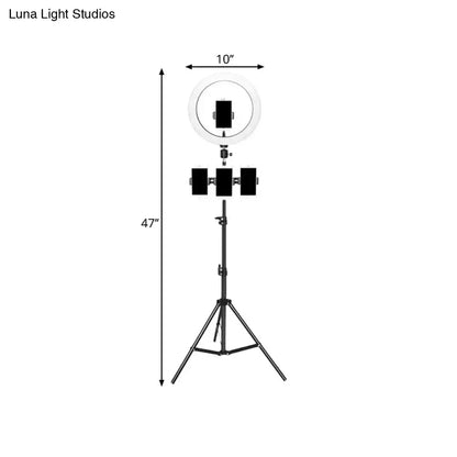 Minimalist black & white mobile phone holder with ring light bedroom