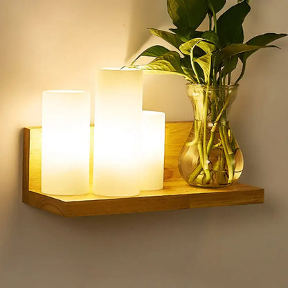 Minimalist brass and glass geometric wall sconce bedroom light