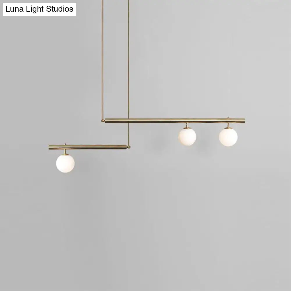 Minimalist brass and white glass ceiling light for kitchen island