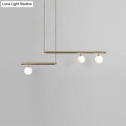 Minimalist brass and white glass ceiling light for kitchen island