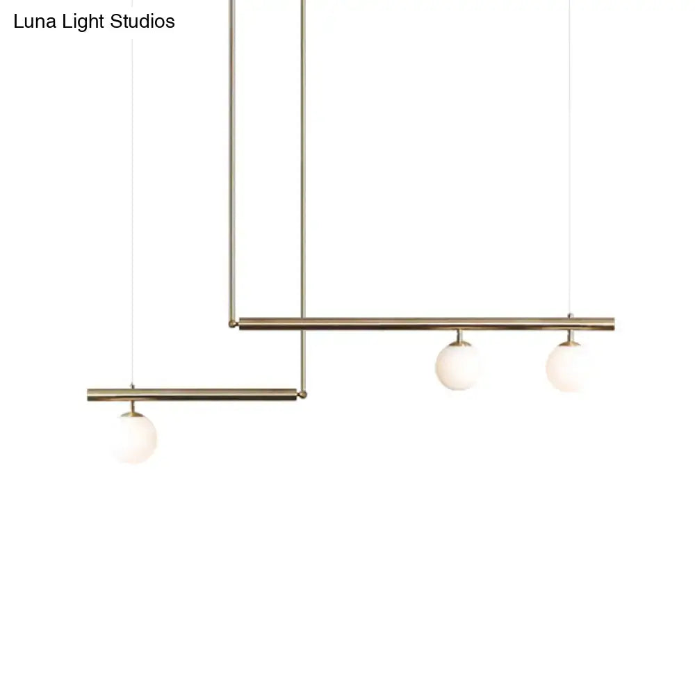 Minimalist brass and white glass ceiling light for kitchen island