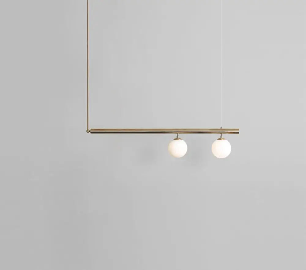 Minimalist brass and white glass ceiling light for kitchen island