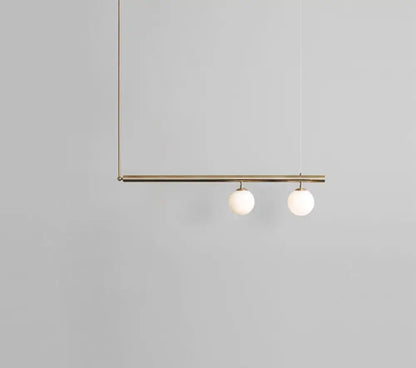 Minimalist brass and white glass ceiling light for kitchen island