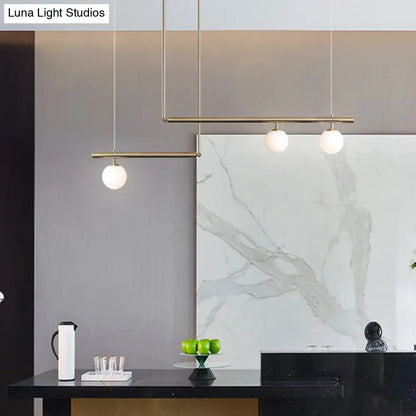Minimalist brass and white glass ceiling light for kitchen island
