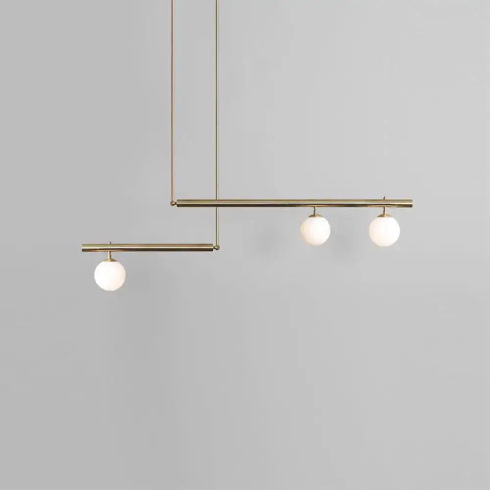 Minimalist brass and white glass ceiling light for kitchen island
