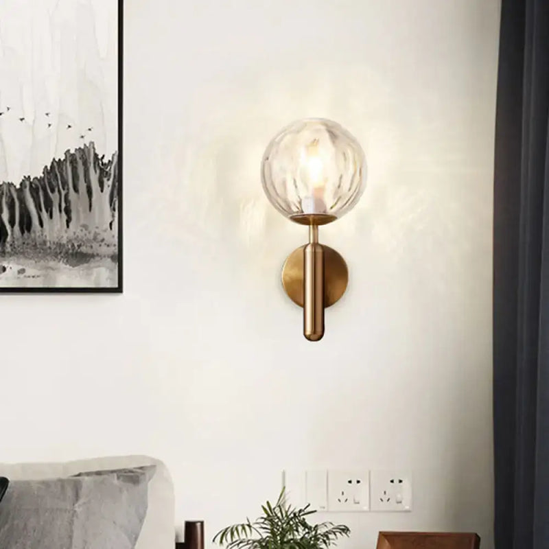Minimalist brass textured glass globe wall mount light for bedroom