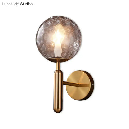 Minimalist brass textured glass globe wall mount light for bedroom