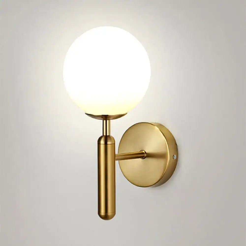 Minimalist brass textured glass globe wall mount light for bedroom