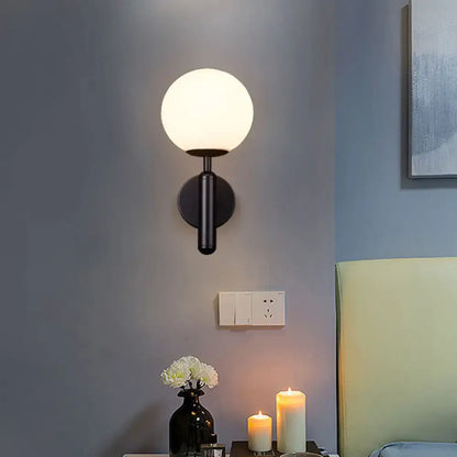 Minimalist brass textured glass globe wall mount light for bedroom