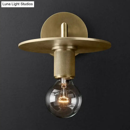 Minimalist bronze wall sconce with glass shade bedroom light