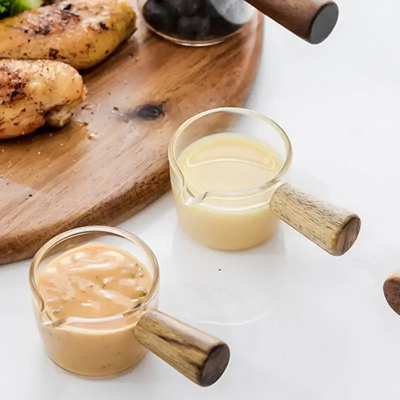 Minimalist clear glass sauce dish with wooden handle kitchen accessory