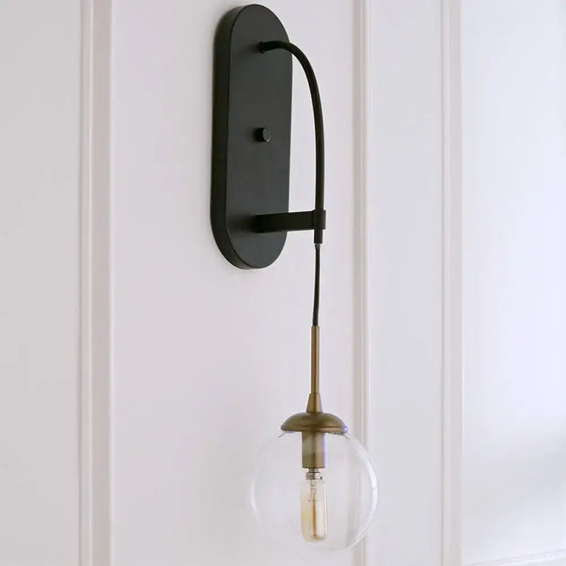 Minimalist clear glass wall mounted sconce black & brass bedroom light