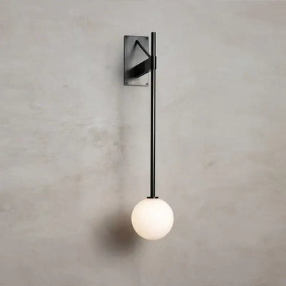 Minimalist geometric iron wall lamp with glass globe for bedroom