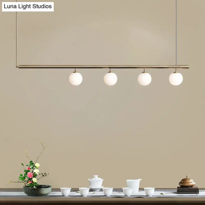 Minimalist golden glass sphere pendant light dining room