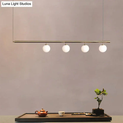Minimalist golden glass sphere pendant light dining room