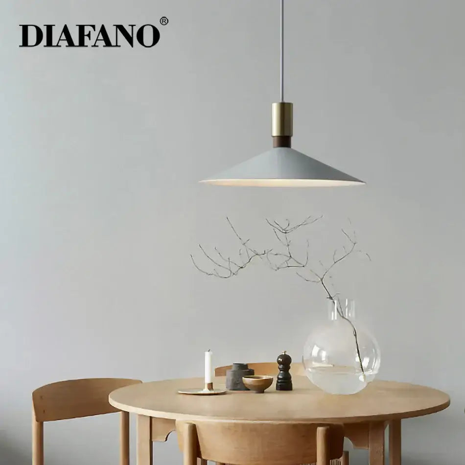 Minimalist gray and brass dimming pendant light for dining room