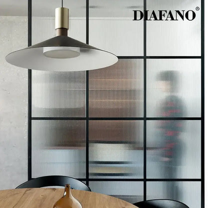 Minimalist gray and brass dimming pendant light for dining room