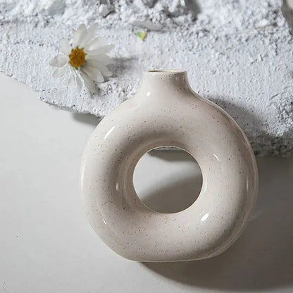 Minimalist speckled off-white ceramic donut candle holder dining room