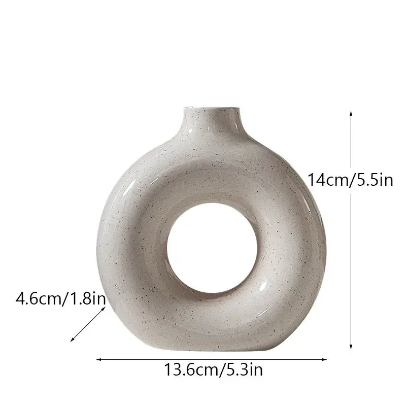 Minimalist speckled off-white ceramic donut candle holder dining room
