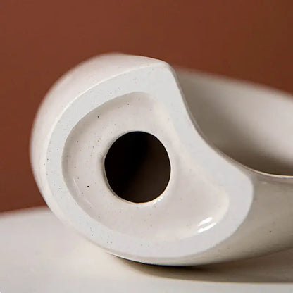 Minimalist speckled off-white ceramic donut candle holder dining room