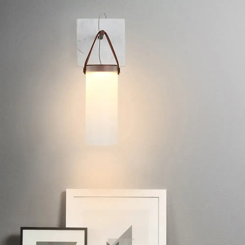 Minimalist white glass wall light with leather strap for bedroom