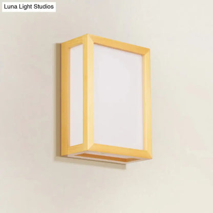 Minimalist white glass wall sconce with wooden frame for corridors