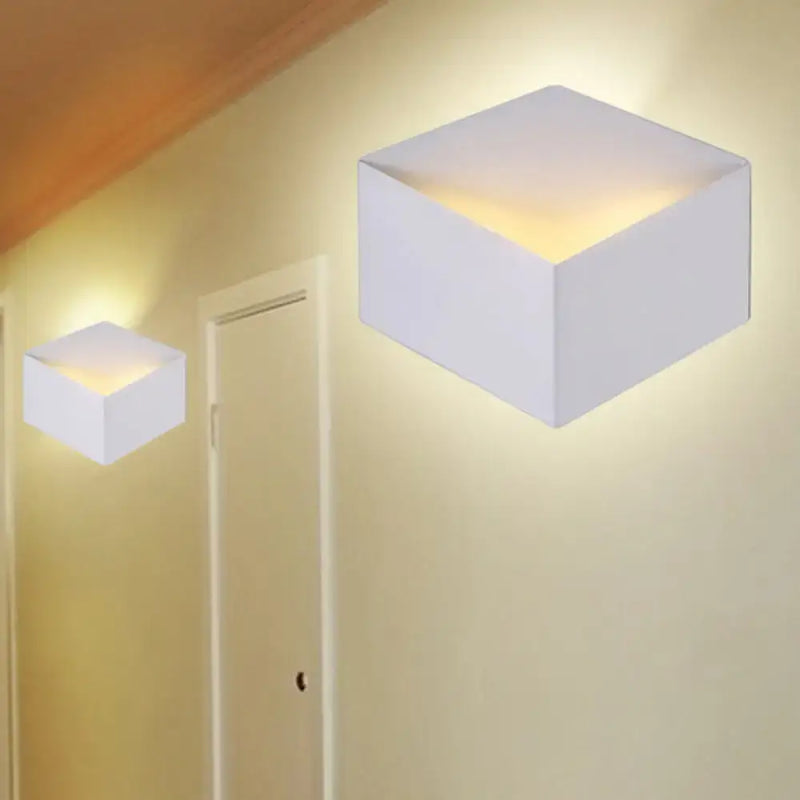Minimalist white metallic geometric wall mount light for corridor