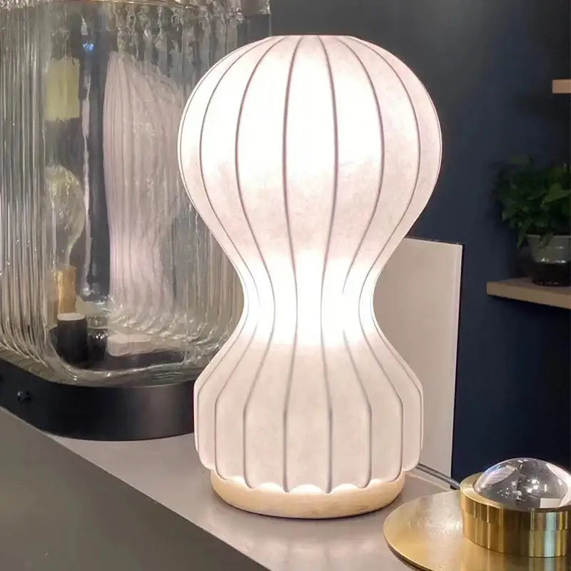 Minimalist white ribbed cocoon silk table lamp for bedroom