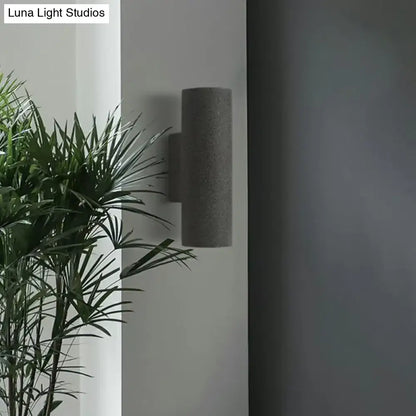 Minimalist white terrazzo stair wall sconce with compact fixture height