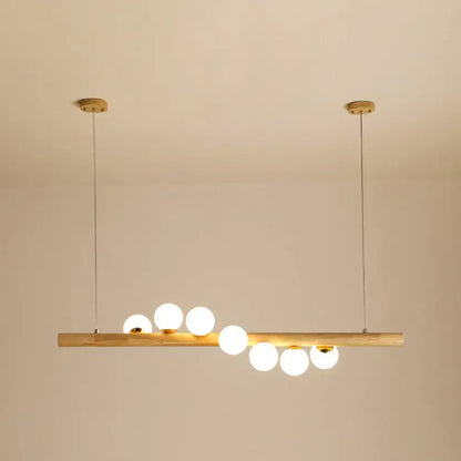 Minimalist wood and glass linear island pendant for kitchen lighting