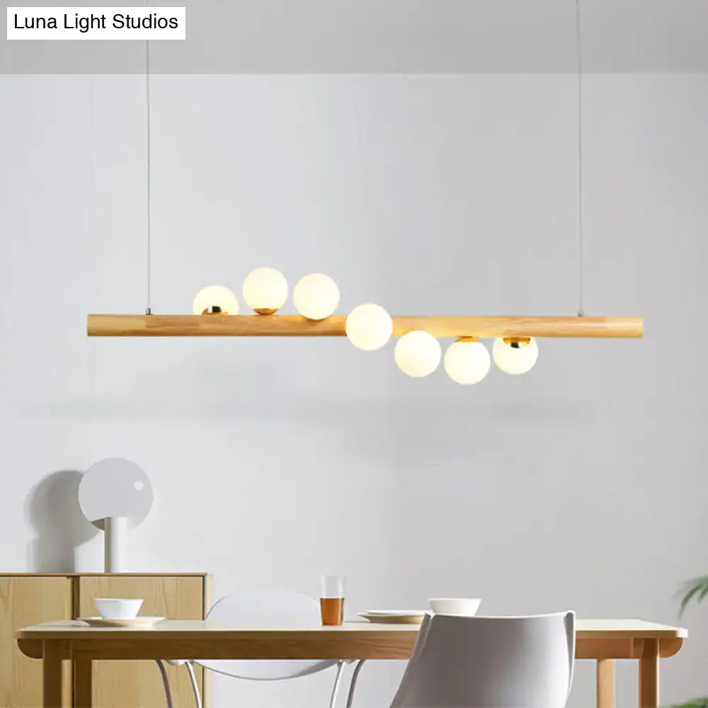 Minimalist wood and glass linear island pendant for kitchen lighting