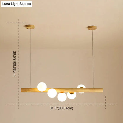 Minimalist wood and glass linear island pendant for kitchen lighting