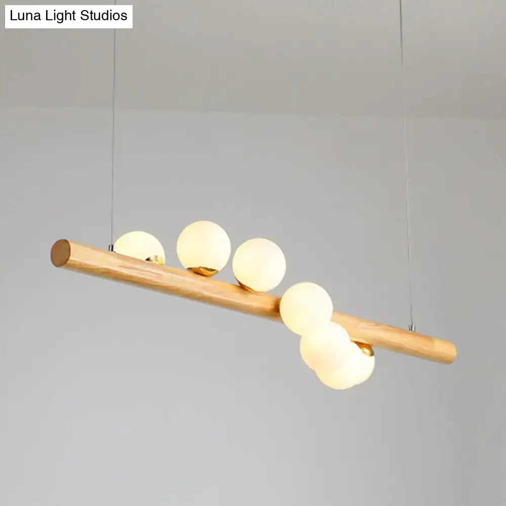 Minimalist wood and glass linear island pendant for kitchen lighting