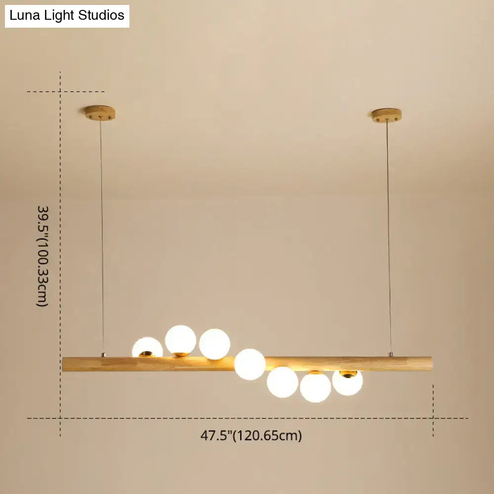 Minimalist wood and glass linear island pendant for kitchen lighting