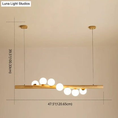 Minimalist wood and glass linear island pendant for kitchen lighting
