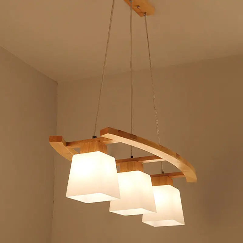 Minimalist wood and ivory glass pendant light dining room